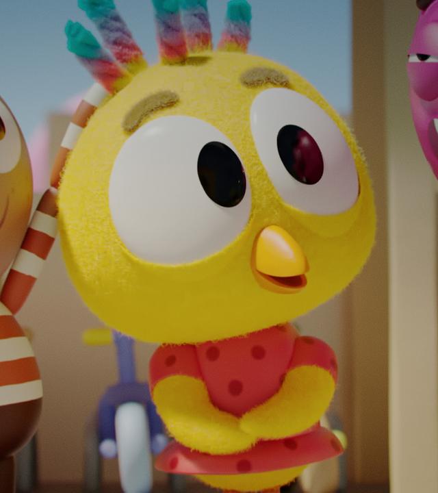 Das Küken Karla steht in der Mitte und hat regenbogenfarbene Locken. Sie hat ihre Arme leicht verschränkt. Links neben ihr steht Alex, ein Mädchen mit gestreiftem Pullover, das Karlas Haare anfasst. Neben Alex steht Glitsch, der Wurm, mit geöffnetem Mund. Rechts neben Karla steht Strike, die Bowling-Kugel und schaut Karla mit leicht geschlossenen Augen an. Tilda Vision, das Mädchen mit Fernsehkopf, steht neben Strike.