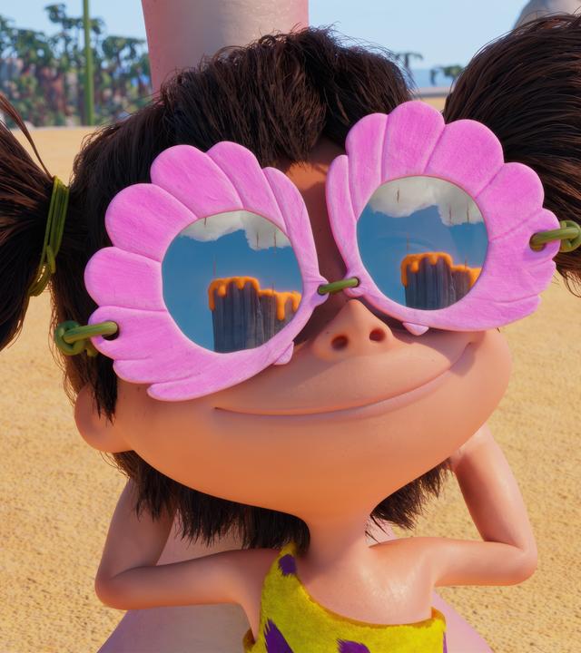 Die wilde Lucy - das Urzeitmädchen mit den abstehenden Zöpfen - trägt eine pinkfarbene, große Brille. In den Brillengläsern spiegelt sich ein Vulkan, der gerade ausbricht.