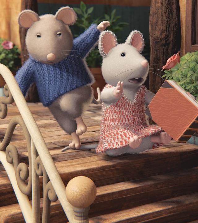  Julia sitzt auf der obersten Treppenstufe der Eingangstreppe des Mäusehauses. Hinter ihr ist Sam auf ihren Schwanz getreten, so dass Julia vor Schreck das Buch aus der Hand gerutscht ist und sich gerade im freien Fall befindet.  Julia schaut erschrocken, Sam sieht verwundert aus. Ein helles Geländer befindet sich auf der Seite der Treppe. Blumenkästen hängen am Geländer und neben dem Hauseingang.