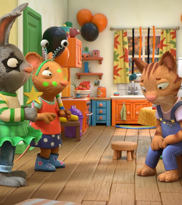 In einem offenen Wohn-Esszimmer, das mit schwarzen und orangefarbenen Luftballons geschmückt ist, stehen die drei Freunde Zac, der Hund, Pip, das Kaninchen und Posy, die Maus betreten schauend vor ihrer Freundin Frankie. Die Katze Frankie sitzt auf einem Stuhl und blickt traurig mit hängenden Schultern nach unten. Während alle anderen kostümiert und geschminkt sind, hat Frankie weder ein Kostüm noch Schminke.