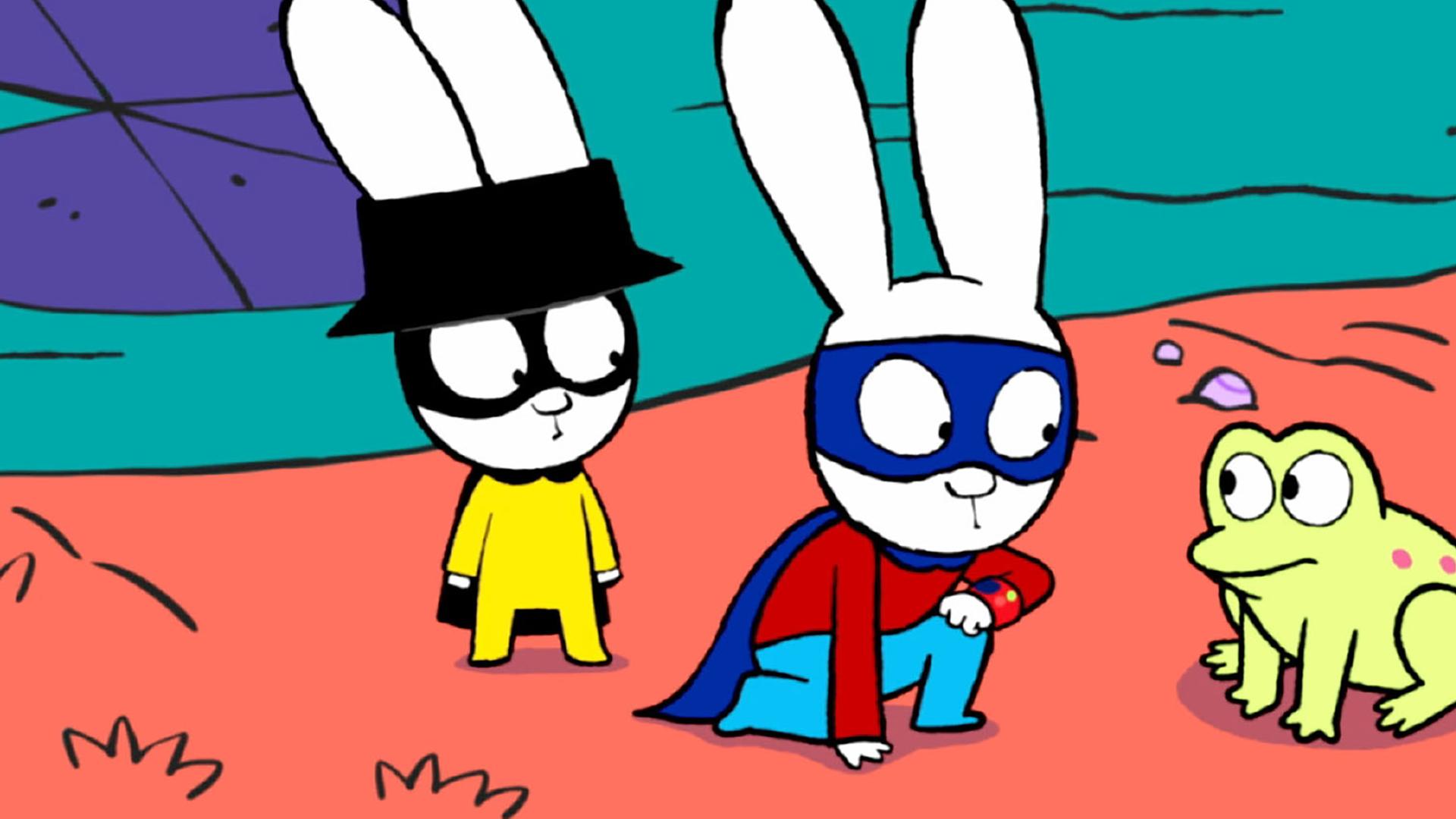 In der Fantasiewelt stehen Captain Hase und Superhase an einem Teich. Superhase kniet fragend vor einem Frosch, der neben ihnen auf dem Boden sitzt. Captain Hase steht hinter Superhase und beobachtet ihn und den Frosch verdutzt.