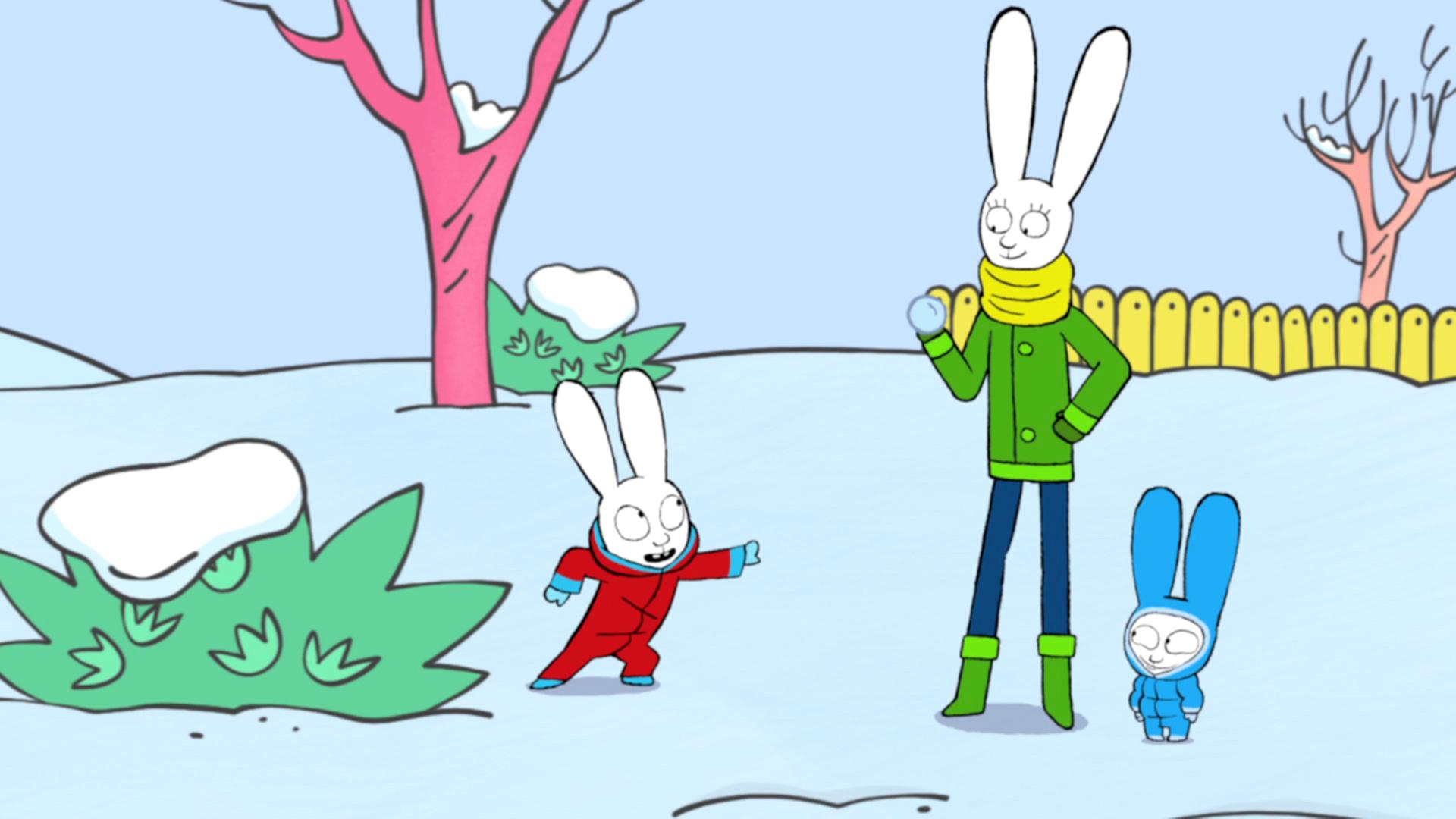 Simon, Mama und Franz stehen gemeinsam im verschneiten Garten. Mama, die zwischen ihren Kindern steht, hält einen Schneeball in ihrer rechten Hand, während Simon frech grinsend auf sie zeigt.