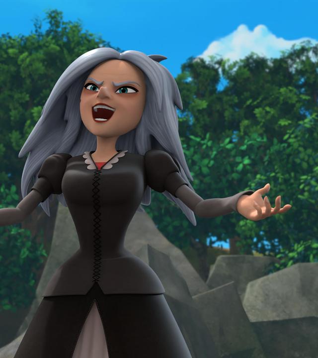 Mit bösem Blick steht Morgan mit dem Rücken zu Bäumen und Felsbrocken. Sie hält ihre Arme seitlich vom Körper ausgestreckt. In einer Hand hält sie einen Zauberstab.