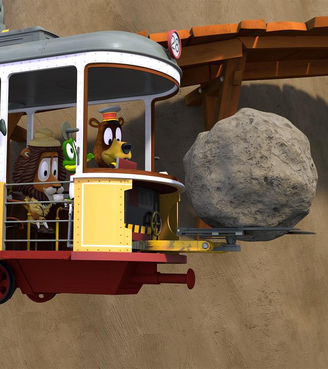 Die Zoobande sitzt in ihrer Bahn, mit welcher sie einen riesigen Felsbrocken aus dem Weg schaffen.