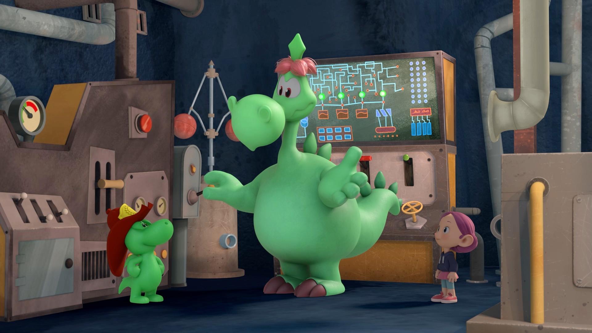 Grisu, der kleine, grüne Drache mit dem roten Feuerwehrhelm, steht zusammen mit seinem Papa Fumé und Stella in einer Art Fabrik. Im Hintergrund ist ein Monitor zu sehen, und Fumé erklärt seinem Sohn gerade die Funktion eines Hebels. Überall sieht man Knöpfe und Rohre und Apparaturen.
