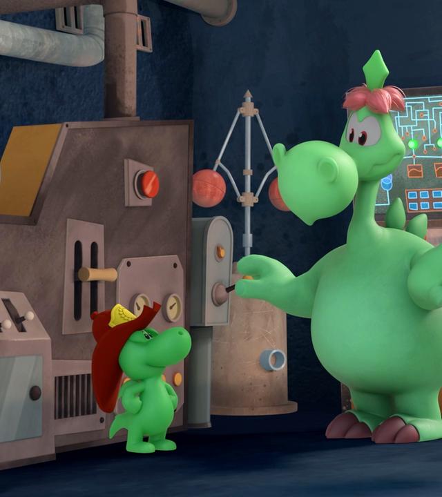 Grisu, der kleine, grüne Drache mit dem roten Feuerwehrhelm, steht zusammen mit seinem Papa Fumé und Stella in einer Art Fabrik. Im Hintergrund ist ein Monitor zu sehen, und Fumé erklärt seinem Sohn gerade die Funktion eines Hebels. Überall sieht man Knöpfe und Rohre und Apparaturen.