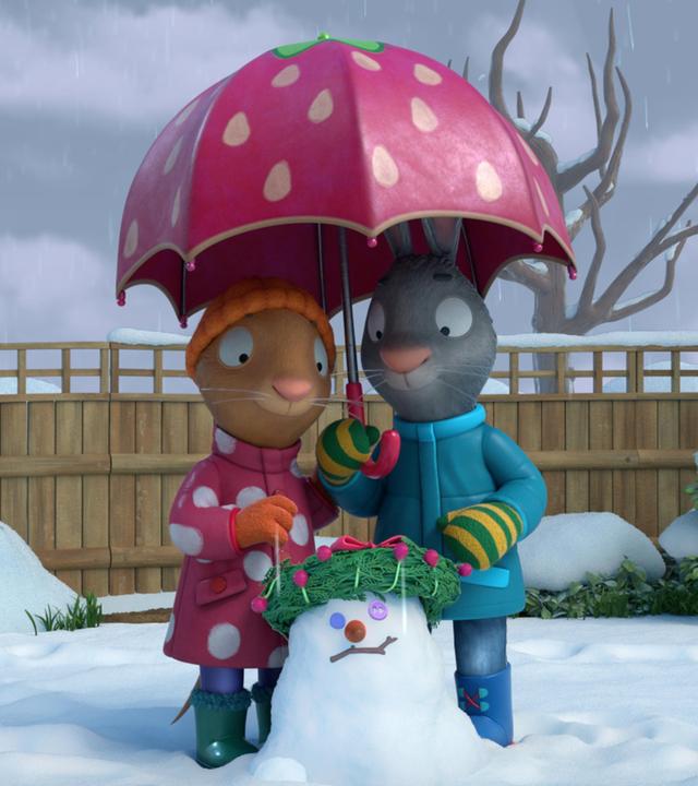 Im Garten liegt Schnee, doch nun regnet es. Pip und Posy stehen mit einem geöffneten Regenschirm über einem kleinen Schneemann. Auf dem Kopf vom Schneemann liegt ein aus grünen Zweigen gebundener Kranz, der mit roten Perlen verziert ist, ein Stock formt den Mund, Knöpfe die Auge und er hat eine rote, runde Nase.