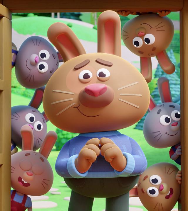 Wir sehen eine offene Tür, in der ein großer, verzweifelt schauender Hase mit blauem Pullover steht. Um ihn herum - in seinem Rücken - schauen kleine Häschen durch die Tür. Sie sehen sehr lebhaft und vergnügt drein.