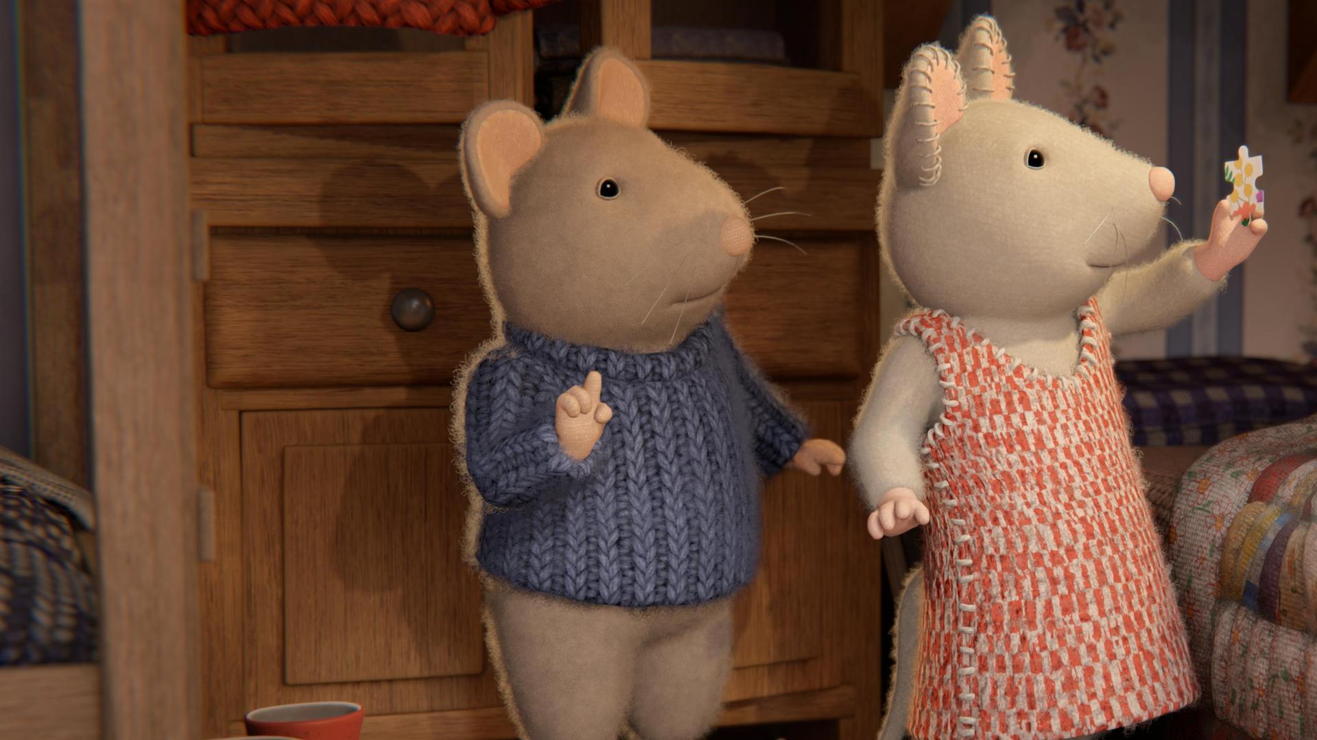 Sam und Julia stehen im Kinderzimmer neben Sams Bett. Julia hält ein Puzzleteil mit der linken Hand in die Höhe. Sie und Sam schauen verwundert darauf.