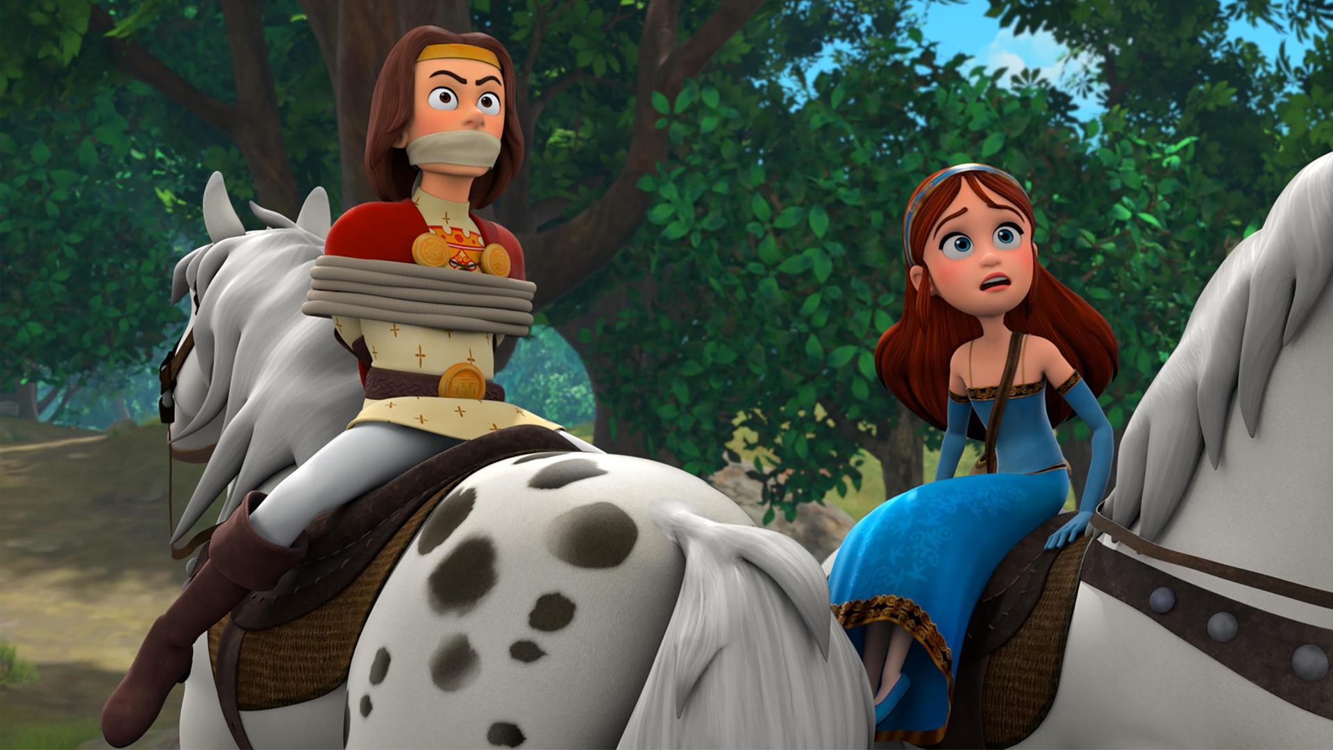  Auf einem Waldweg sitzt König Richard gefesselt, verkehrt herum auf einem Pferd. Marian, die daneben seitlich auf einem Pferd sitzt, blickt ängstlich nach vorne.