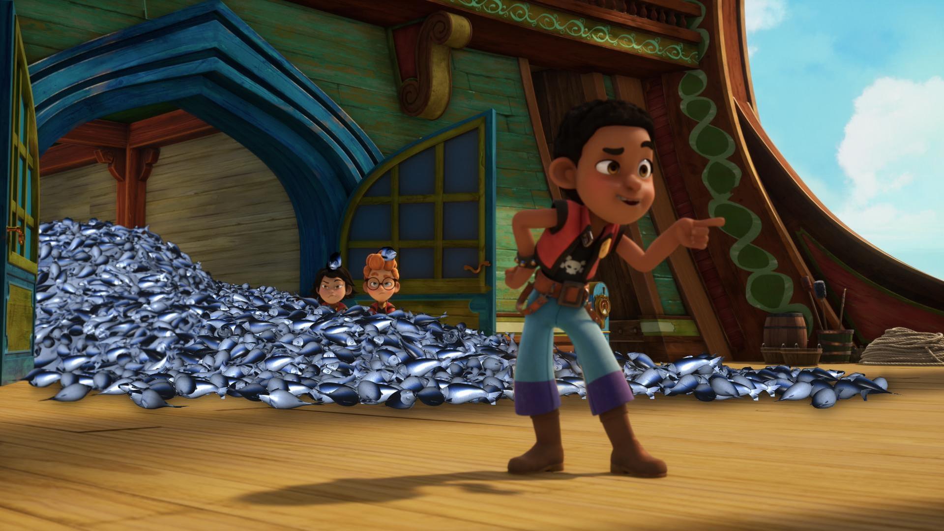 In einem Berg von toten Fischen sitzen Alexander und Zoe. Finn steht weit vorne dran und zeigt hämisch mit seinem Zeigefinger nach vorne.