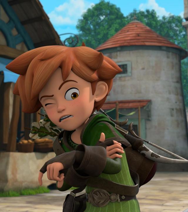 Im Dorf blickt Marian besorgt zu Robin, der sich an seinem linken Arm mit schmerzverzerrtem Gesicht festhält.