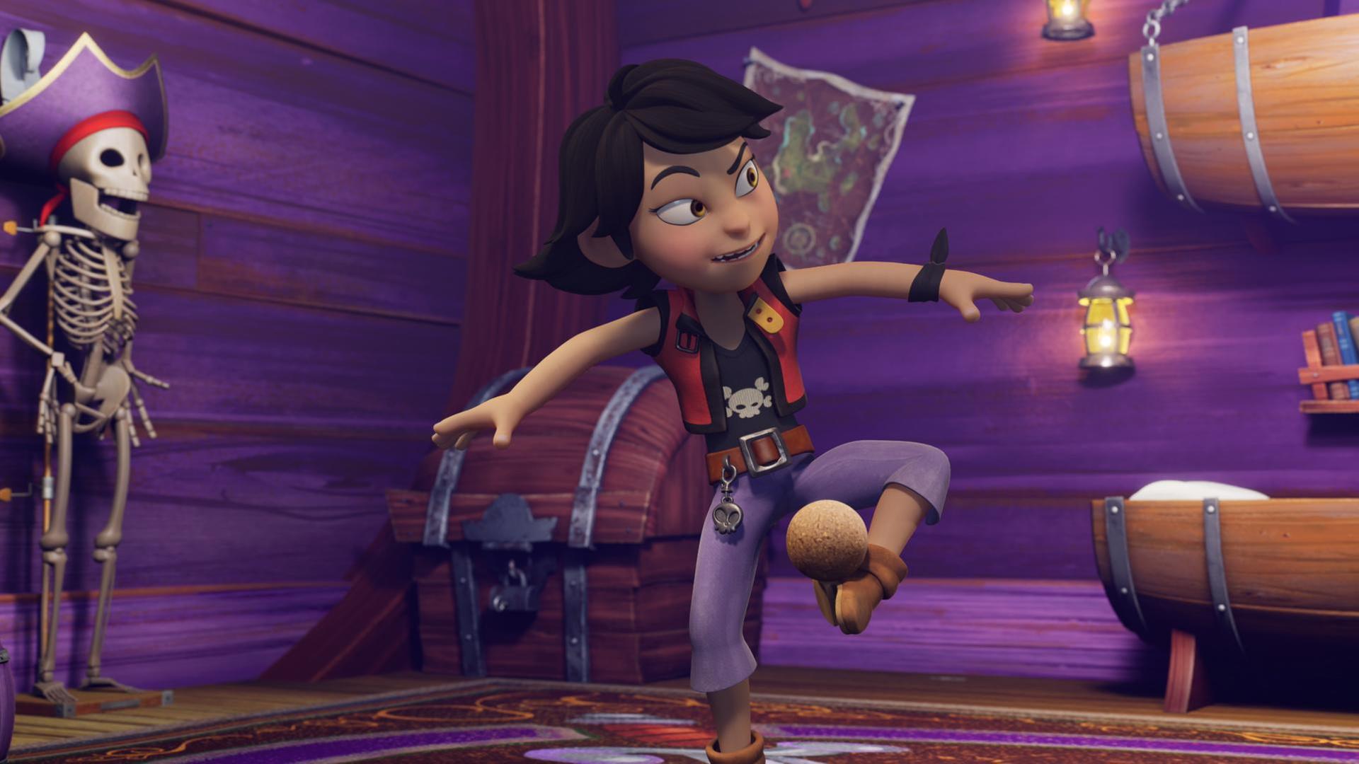 Zoe tanzt fröhlich in ihrem Schlafraum. Auf dem linken Fuß balanciert sie eine Kokosnuss. Seitlich an der Wand steht ein Skelett mit Piratenhut.