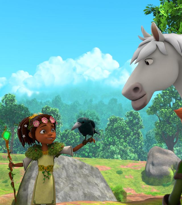 Auf einem Feldweg steht Robin vor dem weißen Pferd Avalanche. Druidin Katell steht links vor ihnen und hält einen schwarzen Raben auf ihrer linken Hand. Mit der rechten Hand hält sie ihren Druidinnnen-Stab.