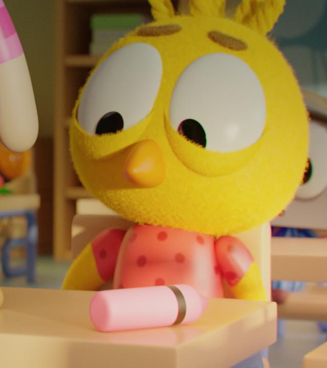 Karla, das kleine gelbe Küken, sitzt im Klassenzimmer an einem Schultisch. Auf dem Tisch liegen ein rosa Stift und ein brauner Kothaufen. Auf dem Tisch steht Othello, der Junge mit dem Tortenkopf.