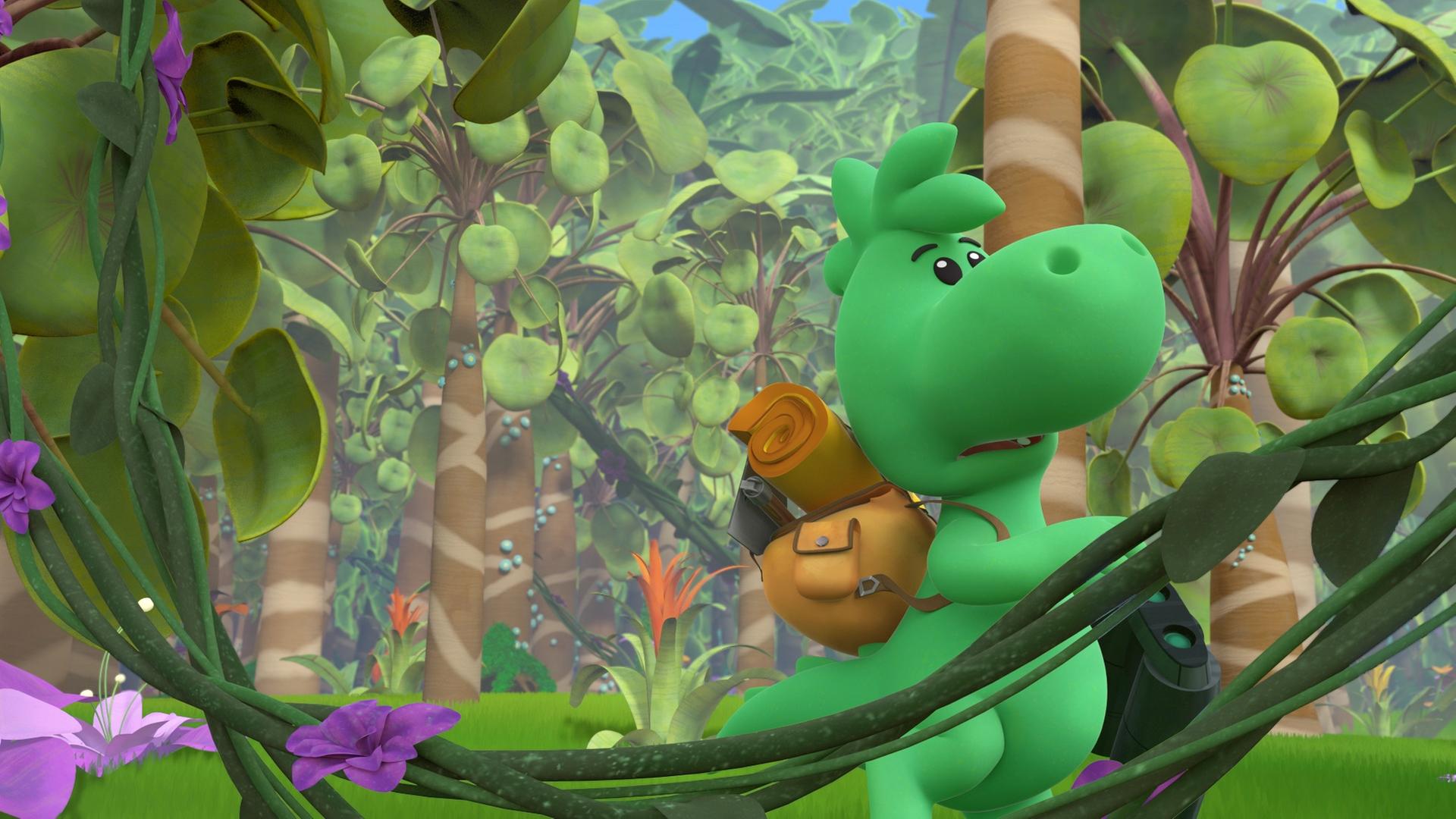 Grisu, der kleine grüne Drache, trägt einen Rucksack auf dem Rücken. Er ist in einem bunten Dschungel unterwegs. Er hält ein Fernglas in der Hand und schaut suchend nach oben.