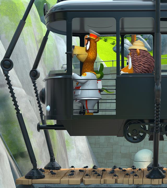 Die Zoobande sitzt in ihrer Bahn, die sich verwandelt hat und nun auf mehreren dünnen Beinen läuft. Unter ihnen ist der ganze Boden voll mit kleinen Spinnen.