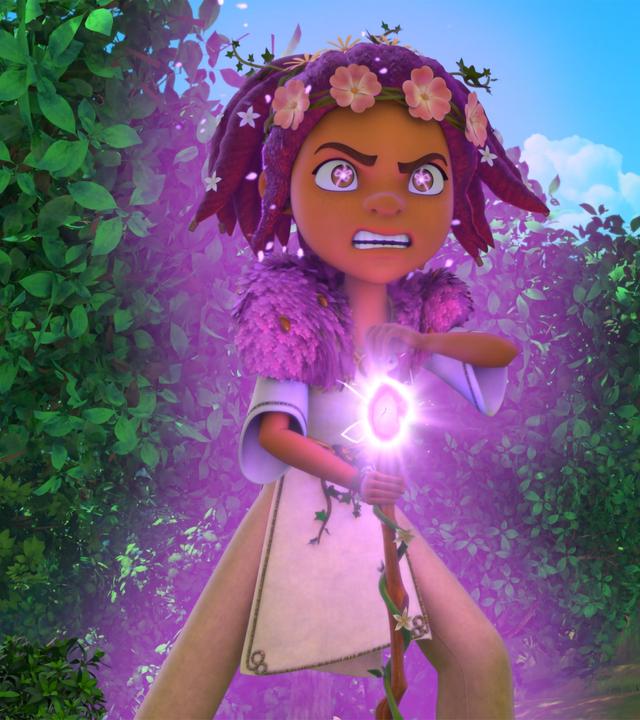  Druidin Katell steht im Wald. Sie sehr zornig nach vorne und hält ihren Druidenstab in der Hand. Der Smaragd ihres Stabs leuchtet lila auf. Auch ihre Augen blitzen lila vor Zorn. Um sie und ihre Gestalt glüht ein lilafarbenes Leuchten.