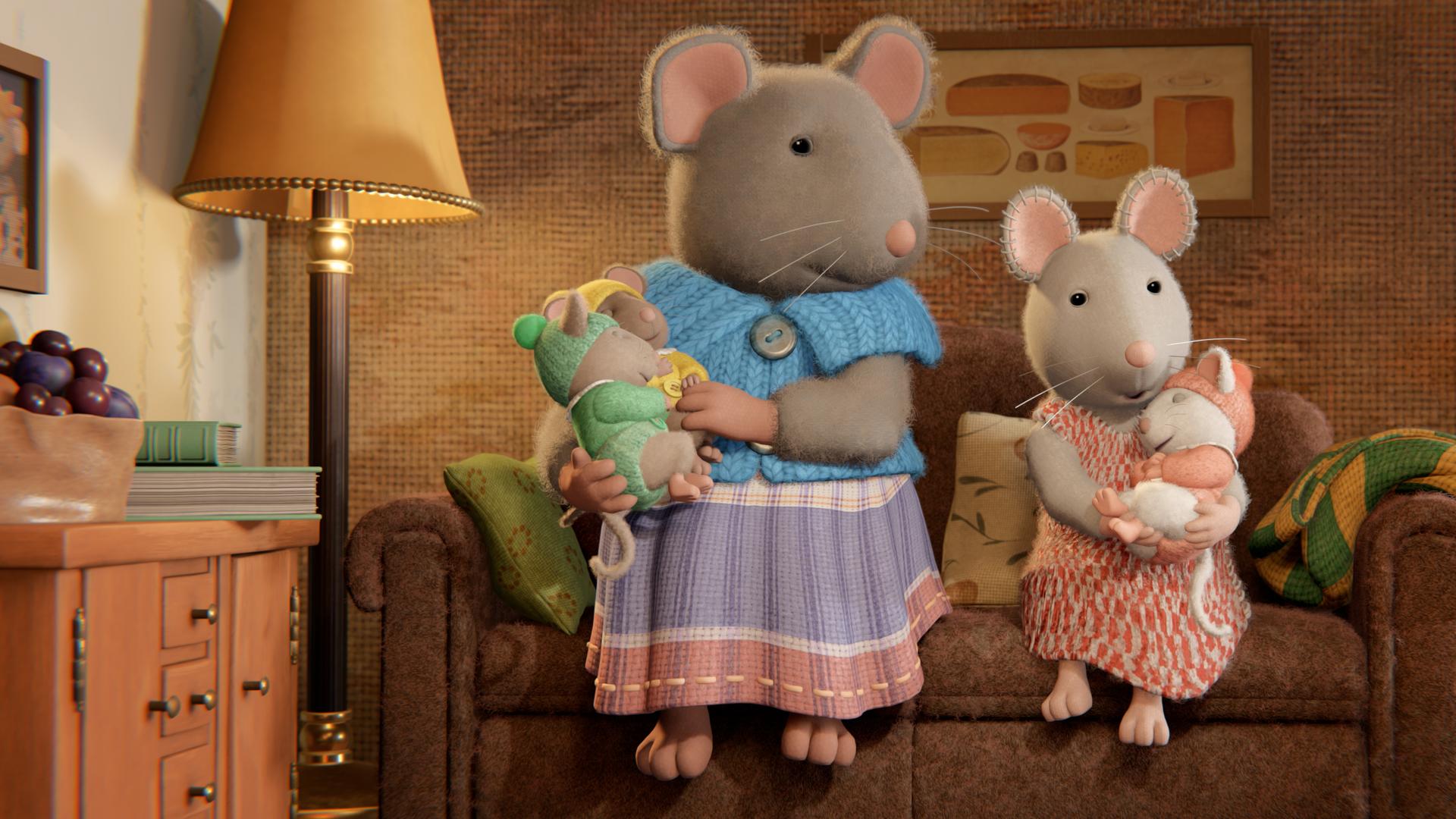 Im Wohnzimmer sitzen Sams Mutter und Julia nebeneinander auf der Couch im Wohnzimmer. Sams Mutter hält ihre zwei kleinen schlafenden Babys im rechten Arm und auch Julia hat ein Baby im Arm, das sich an sie ankuschelt und schläft.