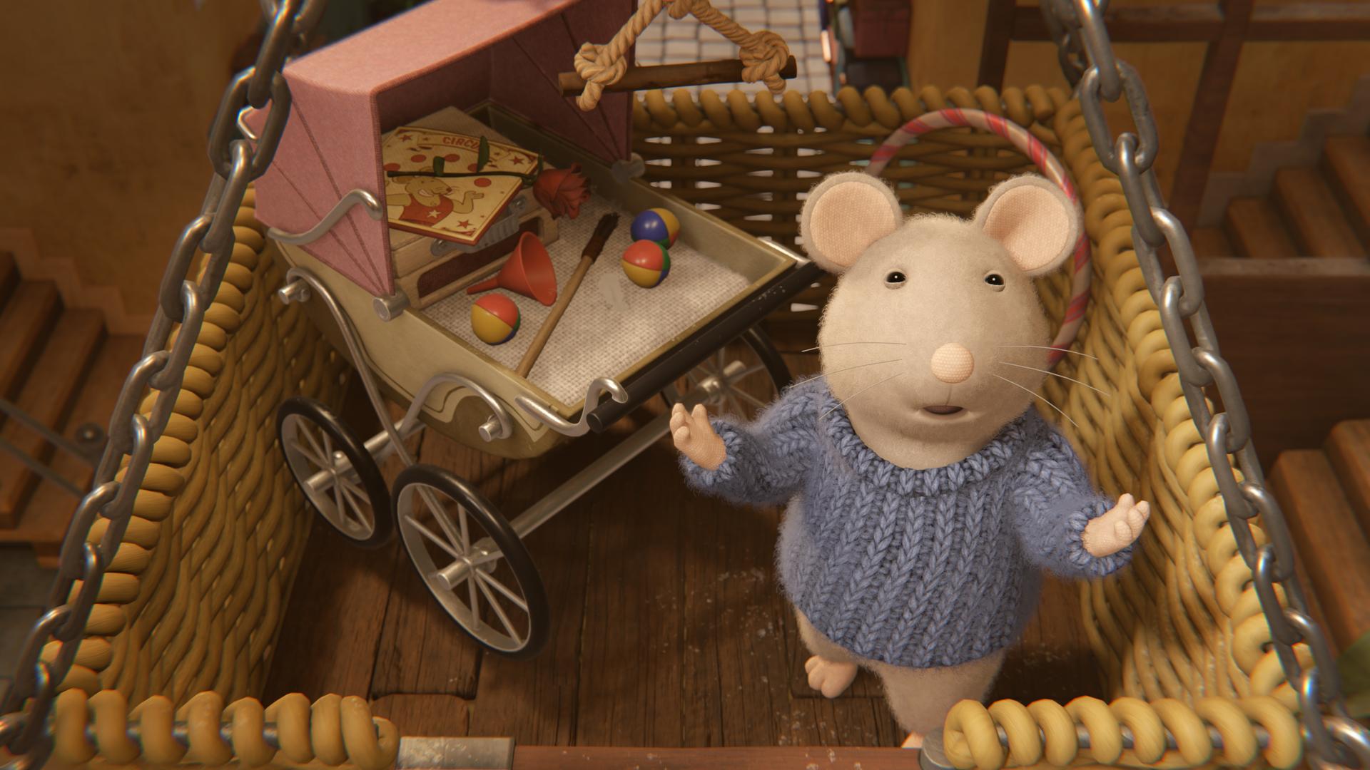 Sam steht in einem großen Korb mit einem Kinderwagen voller Zauberartikel und breitet die Arme aus, um seine Vorstellung zu beginnen.