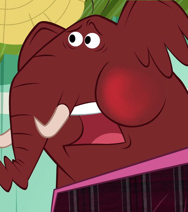 Der Elefant hat zwei Bananen in seinem Rüssel stecken. Deshalb bekommt er kaum Luft. Seine Wangen sind rot und sein Blick ist ängstlich. 