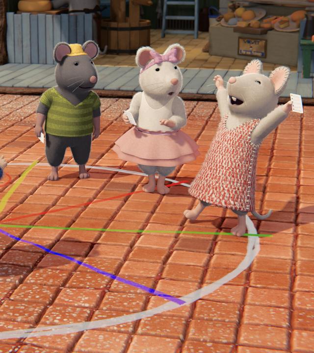 Im Hof des Mäusehauses ist ein weißer Kreis mit bunten Trennlinien darin auf den gepflasterten Boden gemalt. Im Kreis stehen in verschiedenen Feldern Sam, Tonio, Ella und Julia. Julia hat ihre Arme freudig jubelnd in die Höhe gestreckt. Sie hält wie die anderen Mäusekinder einen weißen Zettel in der Hand. Sam, Tonio und Ella schauen aufmerksam zu Julia.