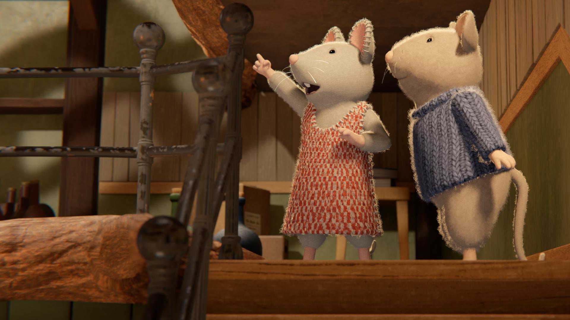 Julia und Sam stehen auf einem Treppenabsatz im Treppenhaus, um sie herum sind Treppenstufen zu sehen. Julia zeigt mit dem ausgestreckten rechten Zeigefinger nach oben, Sam steht seitlich hinter ihr und folgt mit dem Blick der Richtung ihres Fingers.