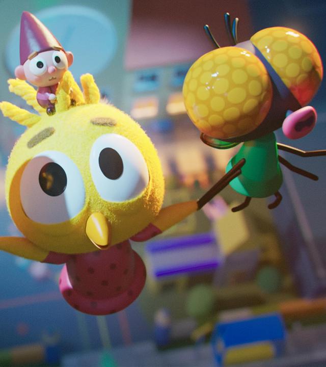 Das Küken Karla fliegt aufwärts, unterstützt durch ihre fliegenden Freunde Fledermaus Vampi und Fliege Brumm, die sie an ihren Flügeln festhalten. Auf Karlas Kopf sitzt Wichtel Bob, der verängstigt blickt. Unter ihnen befindet sich die Schule.