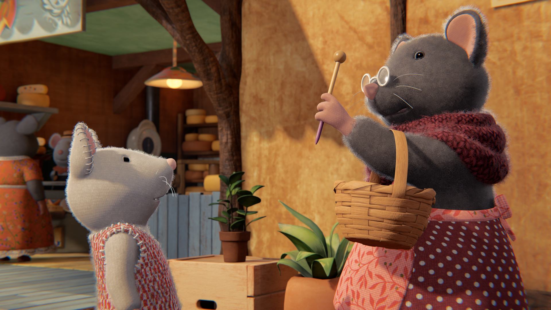 Julia steht Oma Gouda gegenüber, die einen Korb in der Armbeuge hat und diesen Arm hochhält mit einer Stricknadel in der Hand.