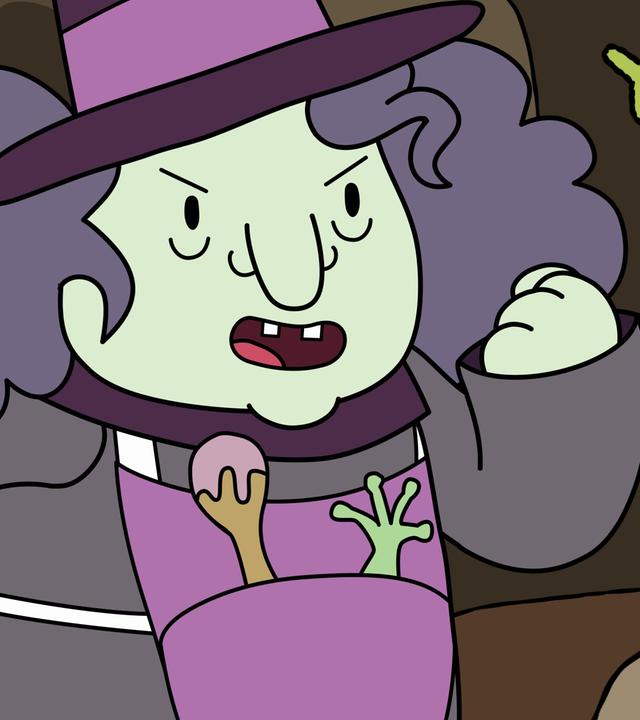 In einer Höhle: Wütend mit geballter Faust zetert eine Hexe die Fee Twinkle an, die dicht vor ihr fliegt. Twinkle hält einen grünen, gezackten Zauberstab stolz grinsend in ihrer Hand.