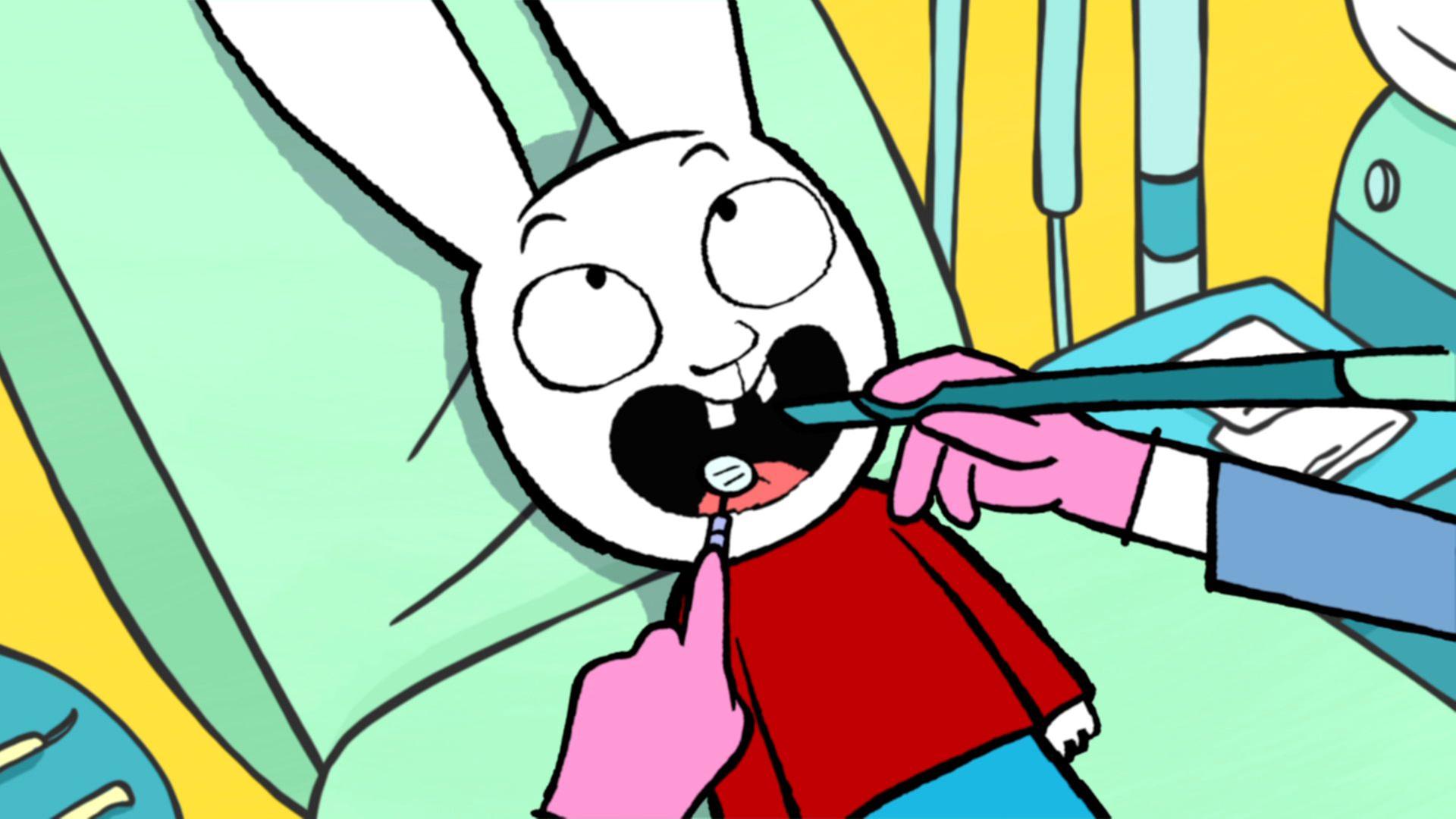 Simon liegt mit weit geöffneten Mund und Blick nach oben auf dem Zahnarztstuhl. Die Zahnärztin hält in ihrer linken Hand einen Mundspiegel und in der rechten Hand eine Absaugkanüle in Simons Mund. Simon hat zwei große Vorderzähne.