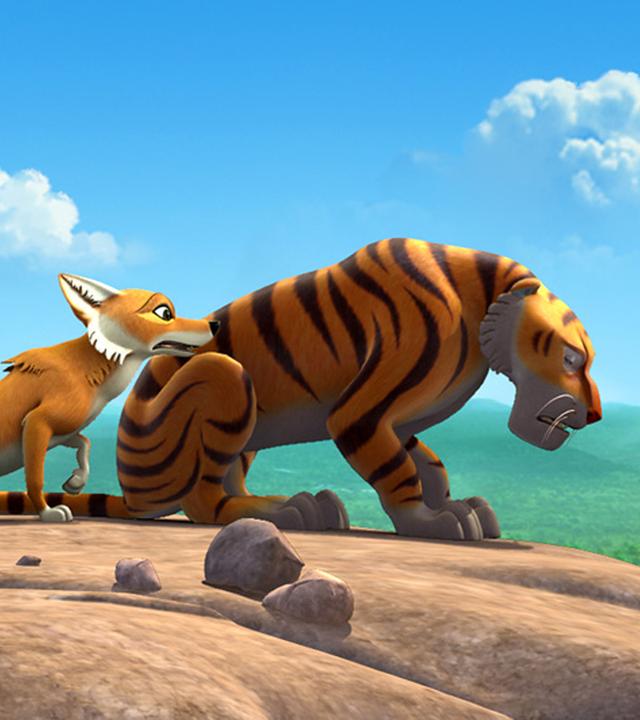 Shir Khan sitzt betrübt an einer Felsklippe, Tabaqui kommt zu ihm gelaufen.