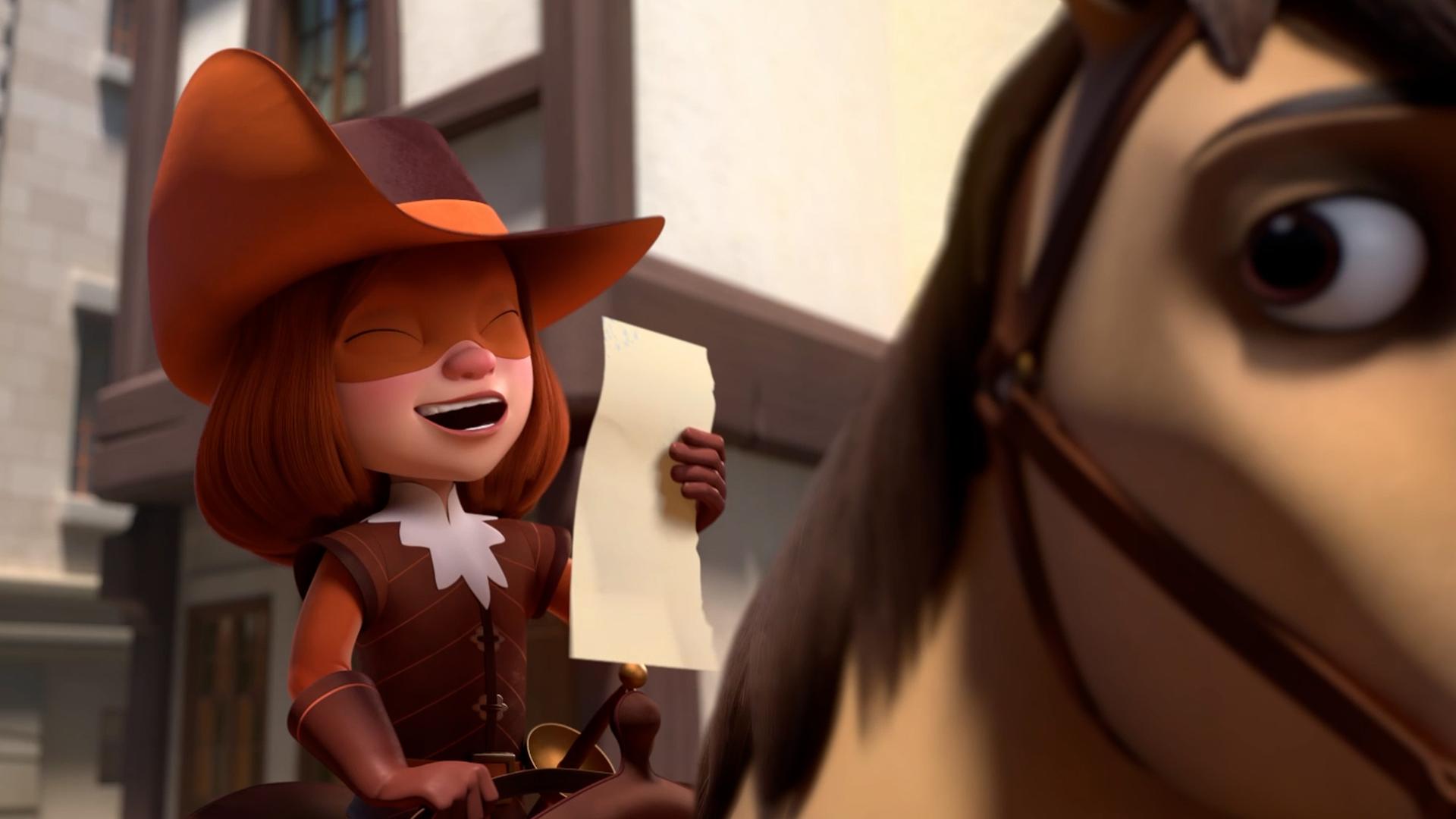  D'Artagnan sitzt mit geschlossenen Augen und herzhaft lachend auf ihrem Pferd. Sie hält ein Blatt Papier in ihrer Hand. Im Hintergrund stehen Fachwerkhäuser.