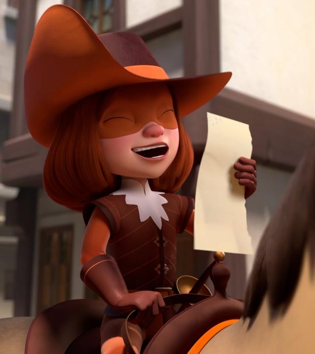  D'Artagnan sitzt mit geschlossenen Augen und herzhaft lachend auf ihrem Pferd. Sie hält ein Blatt Papier in ihrer Hand. Im Hintergrund stehen Fachwerkhäuser.