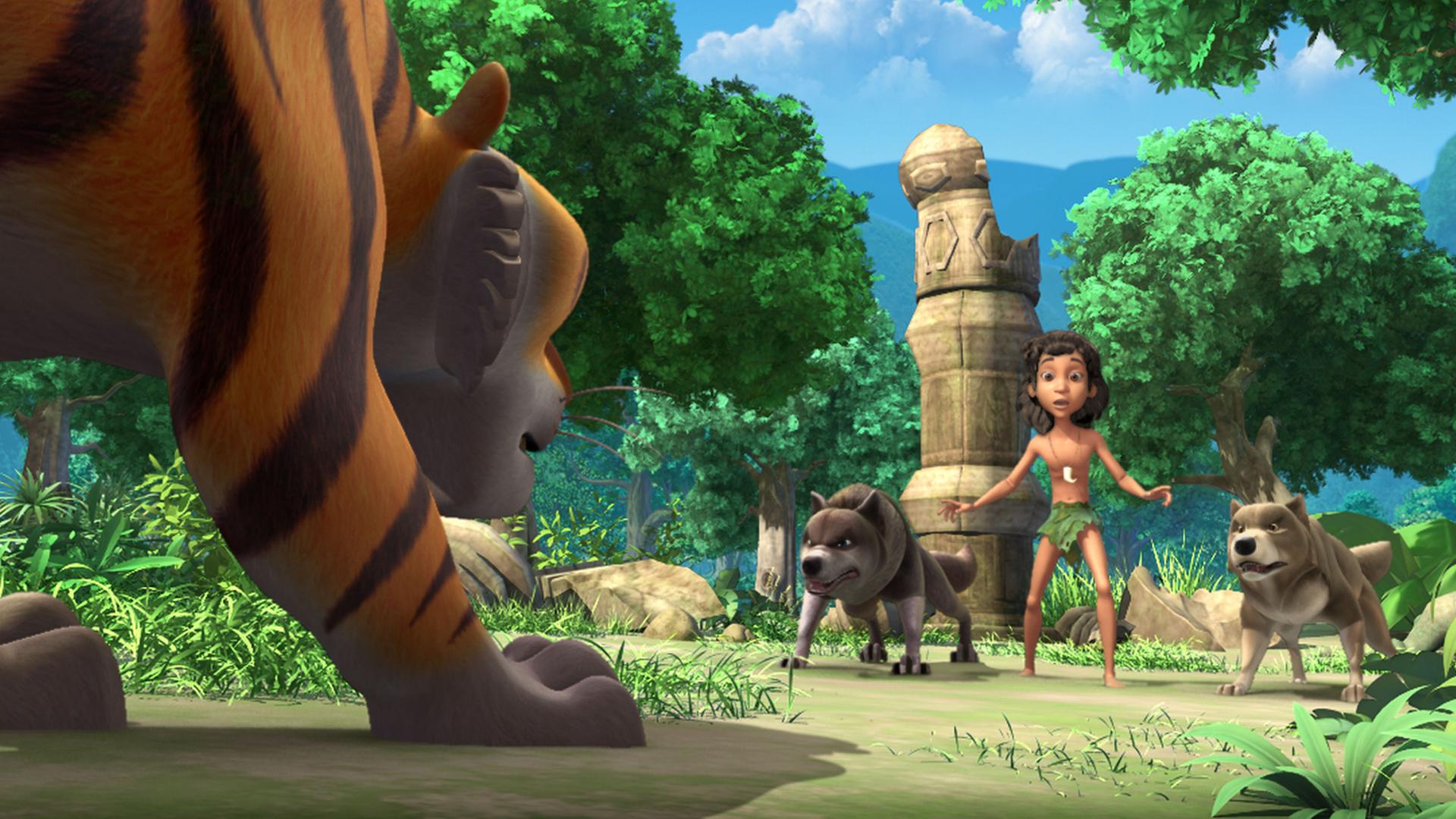 Shir Khan steht groß links im Bild. Er bedroht die vorh ihm stehenden Wölfe Lali und Bala mit Mogli in ihrer Mitte.