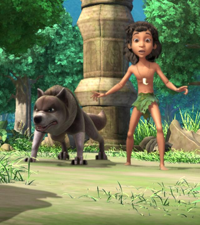 Shir Khan steht groß links im Bild. Er bedroht die vorh ihm stehenden Wölfe Lali und Bala mit Mogli in ihrer Mitte.