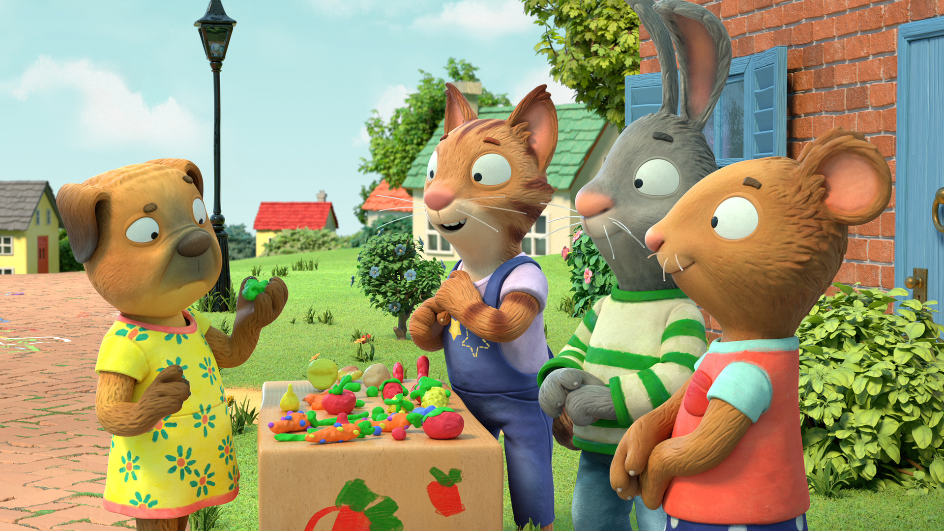 Frankie und Pip und Posy stehen an ihrem Stand, auf dem ihre gekneteten Gerichte liegen. Ein Mops steht auf der anderen Seite des Standes und sieht kritisch ein Stück Brokkoli an.