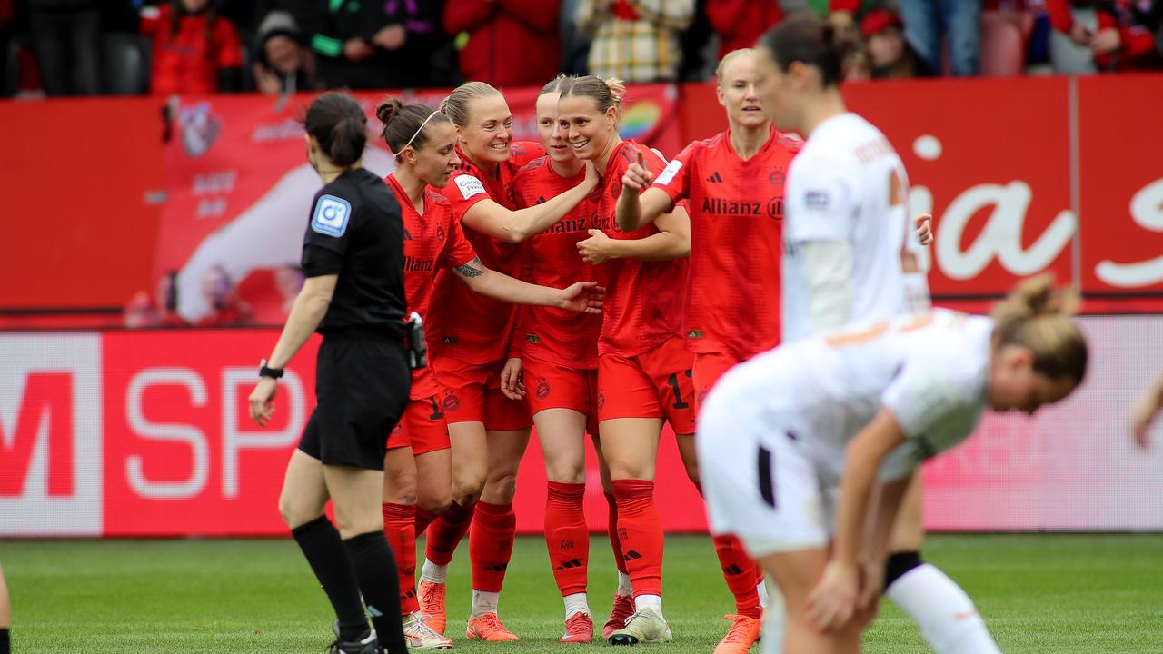 Bayern Munich's players‌ cheer against Leverkusen after Klara ‍Bühl's goal.