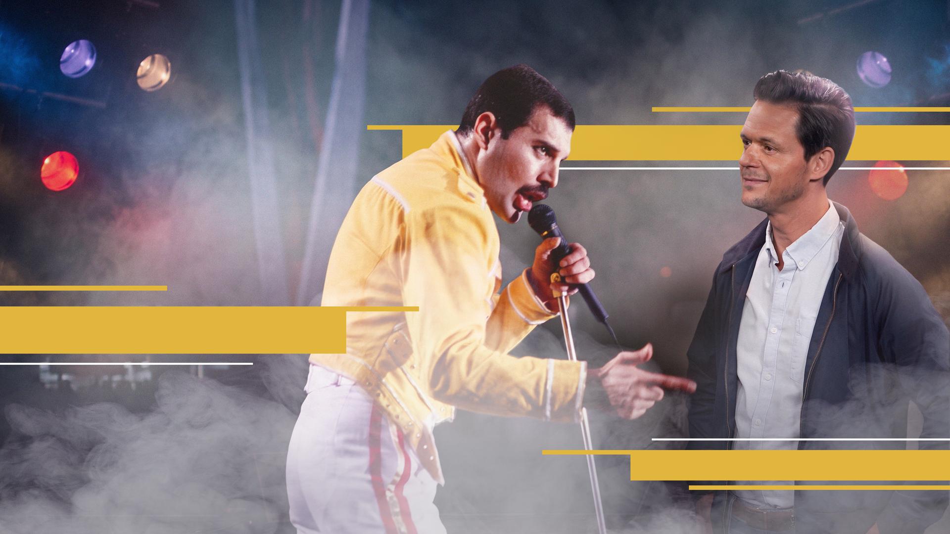 Jo Schück blickt auf eine Foto von Freddie Mercury 