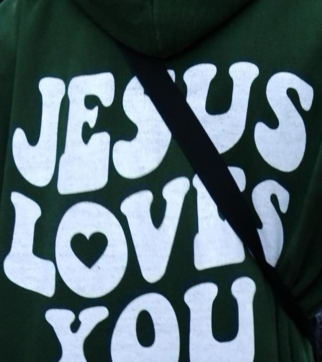 Hoodie mit Aufschrift "Jesus loves you"
