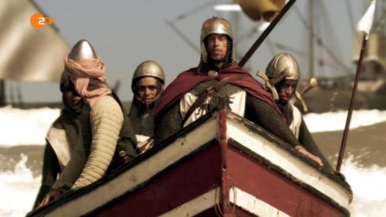 Friedrich II. landet in einem Boot mit anderen Soldaten an der Küste des Heiligen Landes