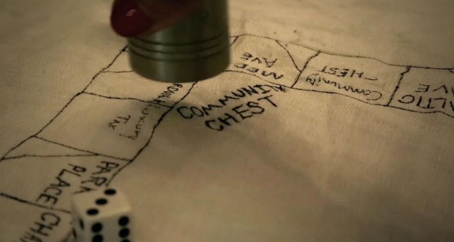 "Geistesblitze: Geld und Gold": Filmszene: Frühes Monopolyspiel aus Stoff.