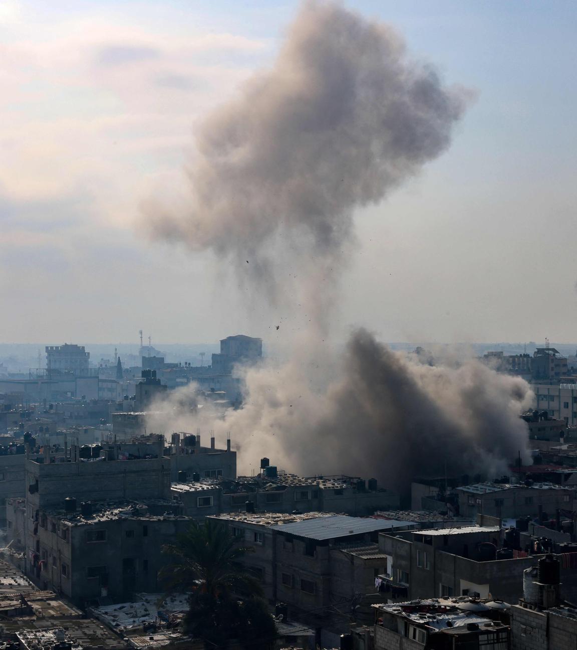  A plume of smoke rises during an Israeli strike on the Rafah refugee camp in the southern Gaza Strip on December 1, 2023, as fighting resumed shortly after the expiration of a seven-day truce between Israel and Hamas militants.