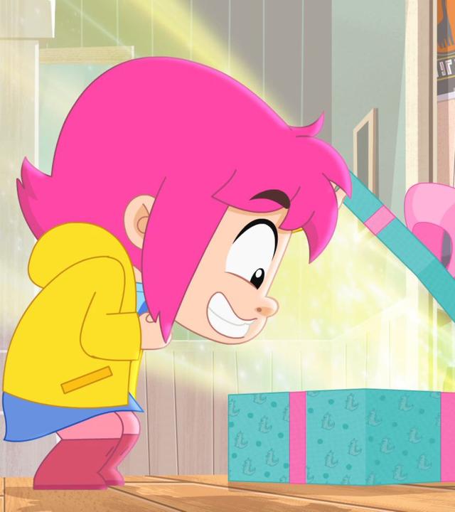 Ernest und Rebecca schauen gespannt auf ein etwas geöffnetes Geschenk.