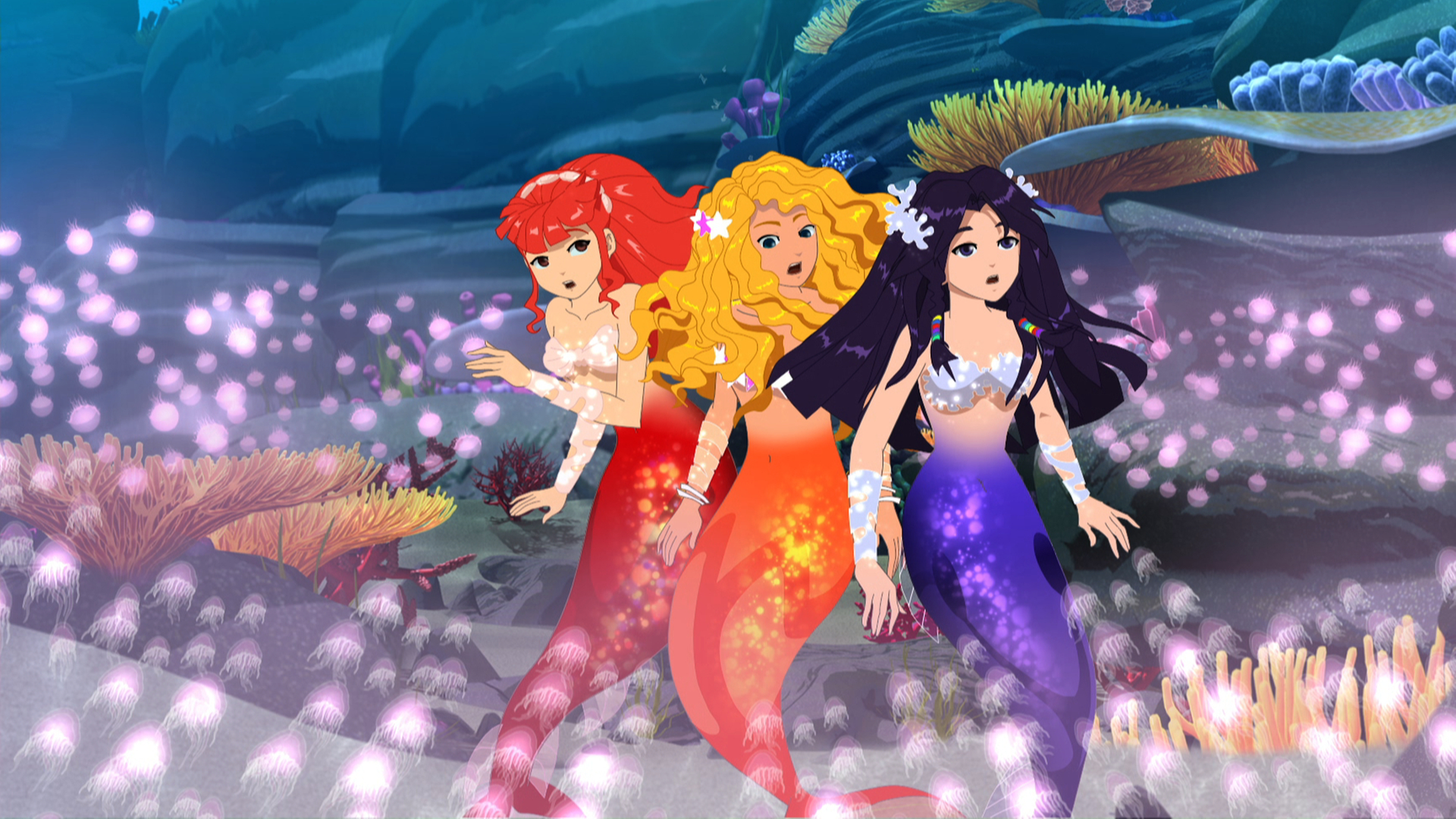 Die Meerjungfrauen Cleo, Emma und Rikki sind von giftigen Quallen umstellt.
