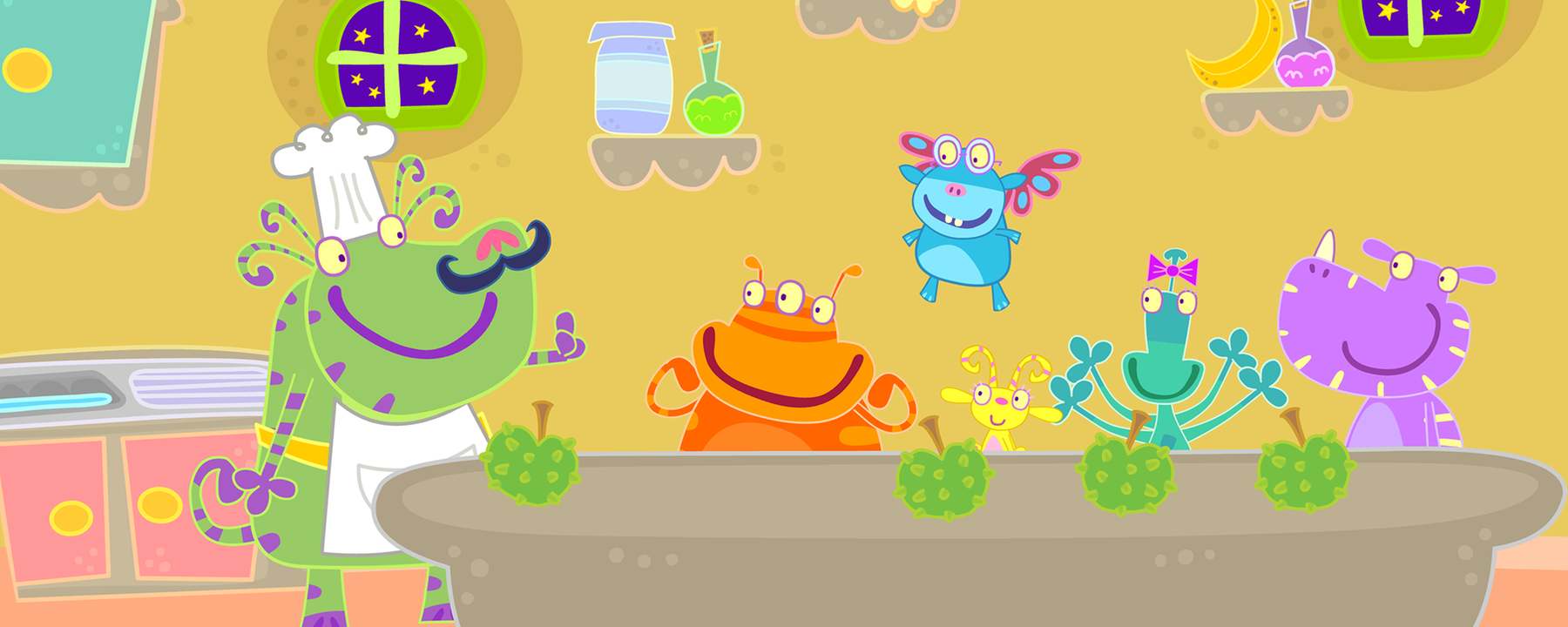 In einer Küche steht Herr Butternuss (links) mit Jamjam, Flügelchen, Winzelschön, Piepa und Schnuffelplumps an einem Tisch, auf dem viele Äpfel liegen. 