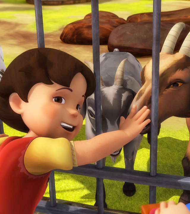 Heidi ist begeistert von den Ziegen, die eingezäunt sind. Sie streichelt sie und schaut zu Clara.