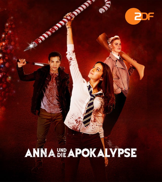 "Anna und die Apokalypse": Plakatmotiv zum Film: Abbildungen von Nick (Ben Wiggins), Anna (Ella Hunt), Steph (Sarah Swire) liegen auf einem roten, nebligen Hintergrund in dem sich eine Tür befindet durch die Zombies einzudringen versuchen.