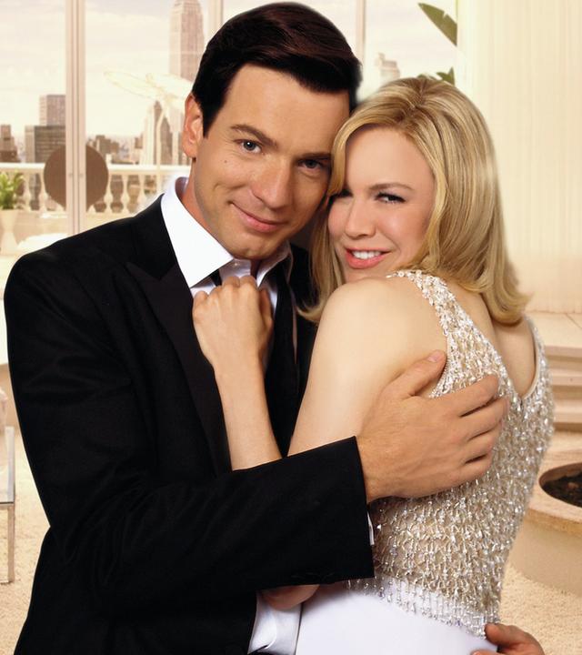 Catcher Block (Ewan McGregor) und Barbara Novak (Renée Zellweger) stehen in enger Umarmung in einem schicken Appartment.