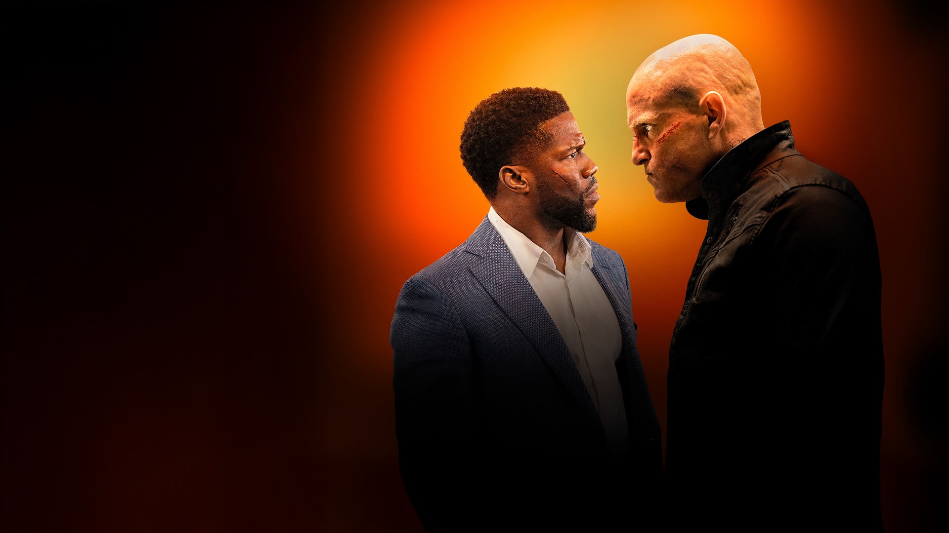 "The Man From Toronto": Teddy Jackson (Kevin Hart) und der Mann aus Toronto (Woody Harrelson) stehen sich gegenüber und schauen sich in die Augen.
